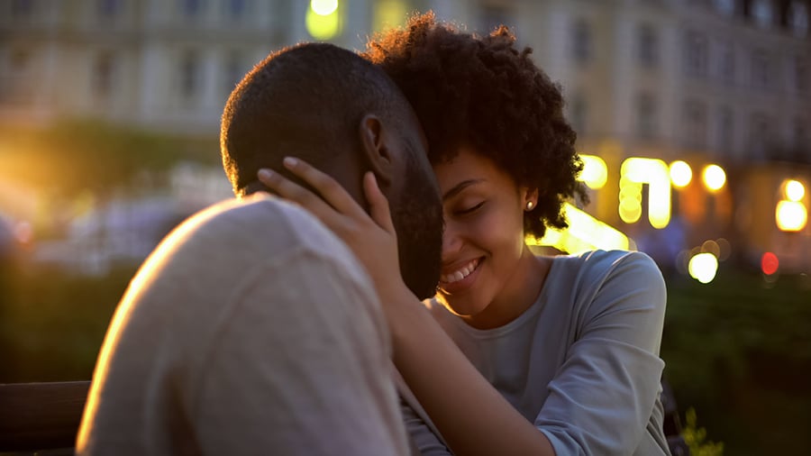 a man and woman kissing